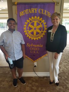 Laura Dosch welcoming local 12 year old and nationally recognized reporter, Jayden Jefferson as a speaker at the Sylvania Rotary.