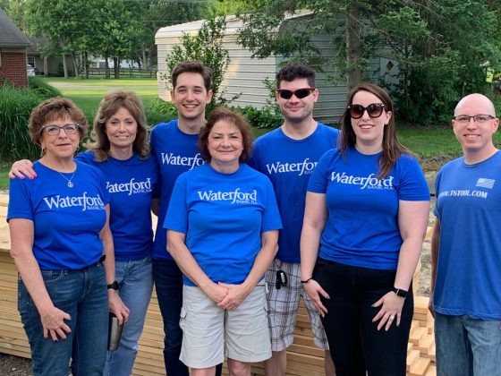 Waterford bankers perform community outreach on a habitat home build.