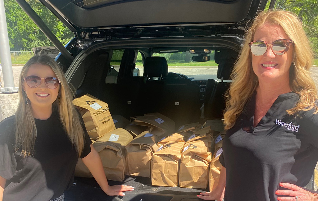 Bankers Gabbi and Angie support community outreach through Mobile Meals delivery.