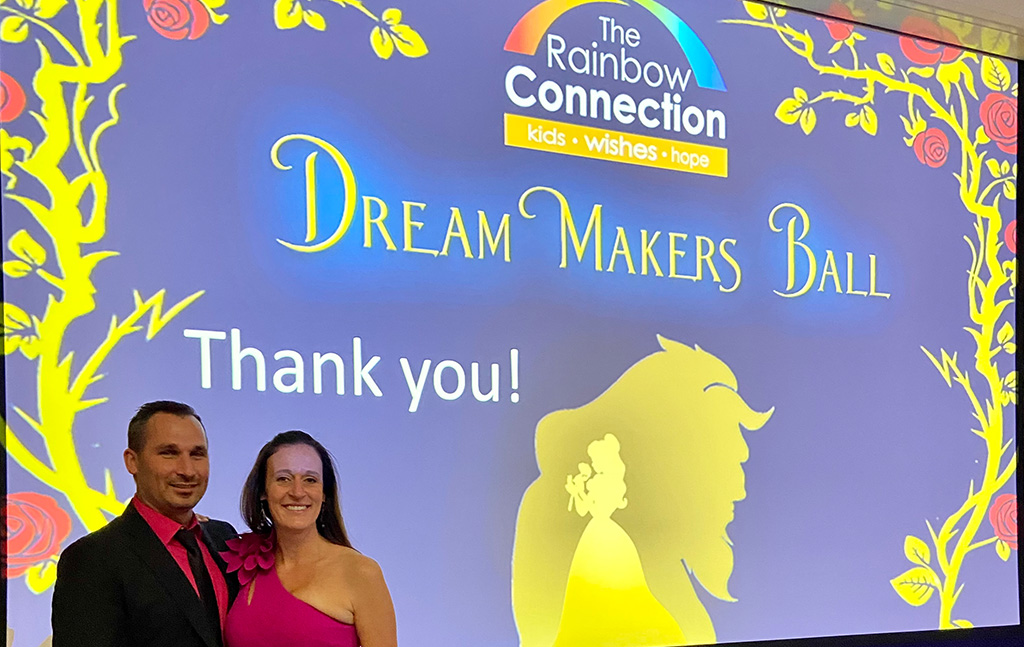 Rebecca Neuman providing community outreach at the Rainbow Connection Dream Makers Ball.